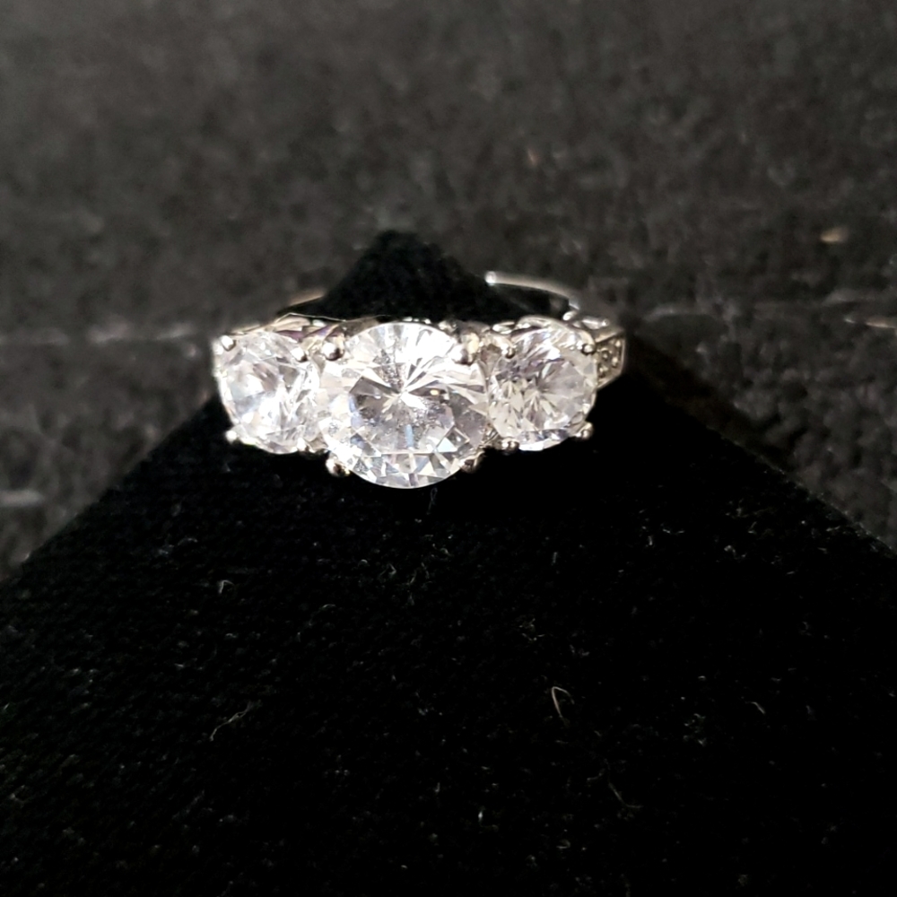 Silver Tone Ring w/3 Cz Stones and CZ Chips on each side
